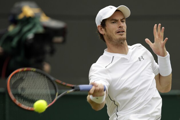 Andy Murray of Britain returns a ball to Robin Haase of the Netherlands, during their singles match at the All England Lawn Tennis Championships in Wimbledon, London, Thursday July 2, 2015. (AP Photo/Alastair Grant)