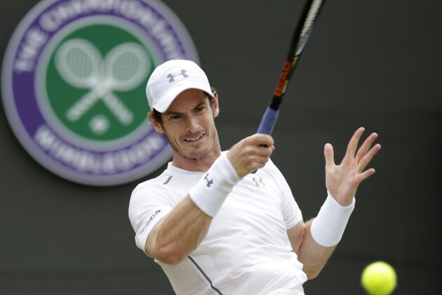 Andy Murray of Britain returns a ball to Robin Haase of the Netherlands, during their singles match at the All England Lawn Tennis Championships in Wimbledon, London, Thursday July 2, 2015. (AP Photo/Alastair Grant)