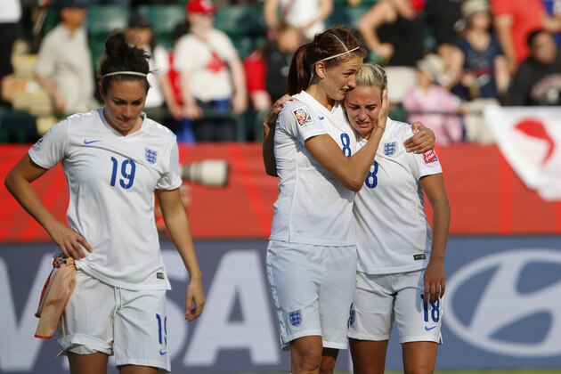 EDMONTON, AB - JULY 1: Jodie Taylor #19, Jill Scott #8 and Toni Duggan #18 of England walk dejected off the pitch after they were defeated by Japan during the FIFA Women's World Cup Canada Semi Final match between England and Japan at Commonwealth Stadium on July 1, 2015 in Edmonton, Alberta, Canada.  (Photo by Todd Korol/Getty Images)