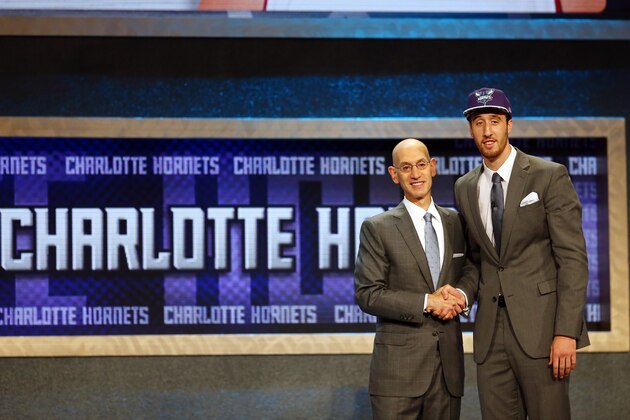 NEW YORK, NY - JUNE 25: Frank Kaminsky poses with Commissioner Adam Silver after being selected ninth overall by the Charlotte Hornets in the First Round of the 2015 NBA Draft at the Barclays Center on June 25, 2015 in the Brooklyn borough of  New York City. NOTE TO USER: User expressly acknowledges and agrees that, by downloading and or using this photograph, User is consenting to the terms and conditions of the Getty Images License Agreement.  (Photo by Elsa/Getty Images)