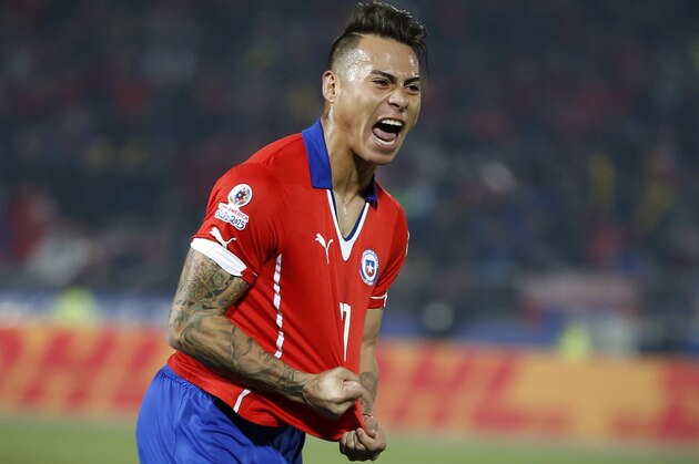 Chile's Eduardo Vargas, right, celebrates after scoring against Peru during a Copa America semifinal soccer match at the National Stadium in Santiago, Chile, Monday, June 29, 2015. (AP Photo/Andre Penner)