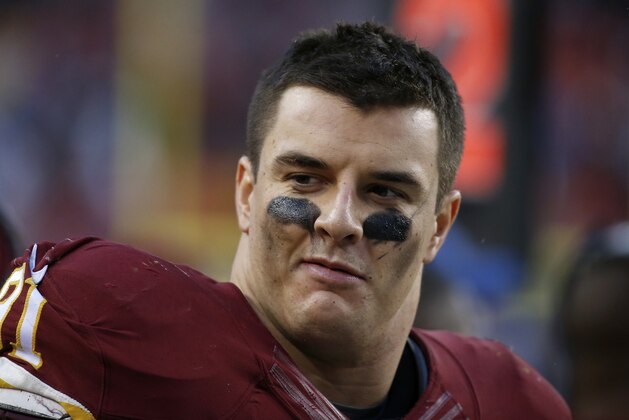 Washington Redskins outside linebacker Ryan Kerrigan (91) looks down the bench during the second half of an NFL football game against the Dallas Cowboys in Landover, Md., Sunday, Dec. 28, 2014. The Cowboys won 44-17. (AP Photo/Alex Brandon)