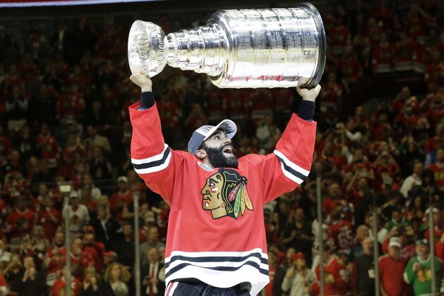 Chicago Blackhawks’ Johnny Oduya, of Sweden, celebrates after defeating the Tampa Bay Lightning in Game 6 of the NHL hockey Stanley Cup Final series on Monday, June 15, 2015, in Chicago. The Blackhawks defeated the Lightning 2-0 to win the series 4-2. (AP Photo/Nam Y. Huh)