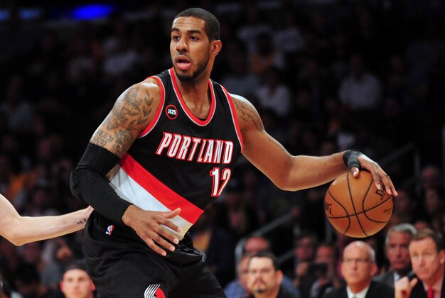 April 3, 2015; Los Angeles, CA, USA; Portland Trail Blazers forward LaMarcus Aldridge (12) controls the ball against the Los Angeles Lakers during the first half at Staples Center. Mandatory Credit: Gary A. Vasquez-USA TODAY Sports