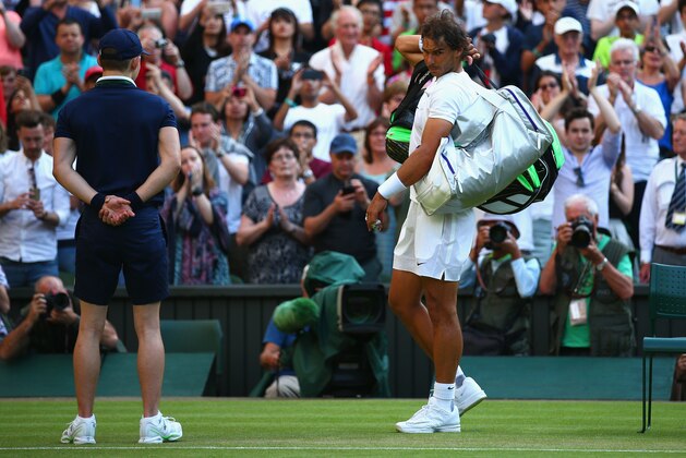 LONDON, ENGLAND - JULY 02:  Rafael Nadal of Spain leaves the court dejected after losing his Gentlemens Singles Second Round match against  Dustin Brown of Germany during day four of the Wimbledon Lawn Tennis Championships at the All England Lawn Tennis and Croquet Club on July 2, 2015 in London, England.  (Photo by Ian Walton/Getty Images)