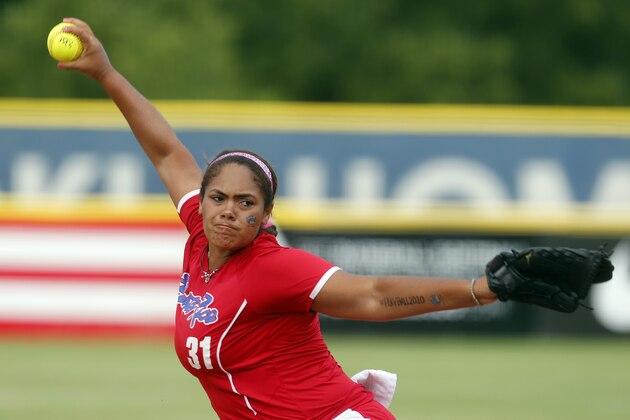 Puerto Rico's Lissette Garay pitches against the US in the first inning of a World Cup of Softball tournament game in Oklahoma City, Sunday, July 14, 2013. The United States won 10-3. (AP Photo/Sue Ogrocki)