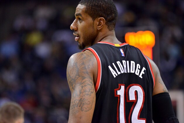 Portland Trail Blazers forward LaMarcus Aldridge (12) plays in the first half of an NBA basketball game Saturday, Jan. 17, 2015, in Memphis, Tenn. (AP Photo/Brandon Dill)