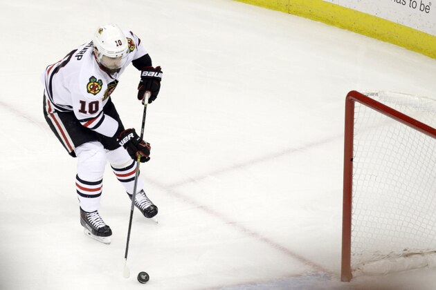 Chicago Blackhawks left wing Patrick Sharp (10) knocks the puck into an open goal for a score against the Tampa Bay Lightning during the first period of Game 5 of the NHL hockey Stanley Cup Final, Saturday, June 13, 2015, in Tampa, Fla. (AP Photo/John Raoux)