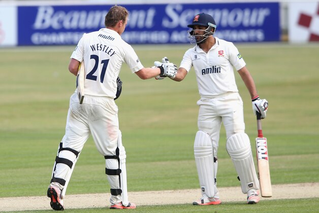 CHELMSFORD, ENGLAND - JULY 02:  Tom Westley (L) of Essex is congratulated by team mate Ravi Bopara after scoring a century during day two of the tour match between Essex and Australia at The Ford County Ground on July 2, 2015 in Chelmsford, England.  (Photo by David Rogers/Getty Images)