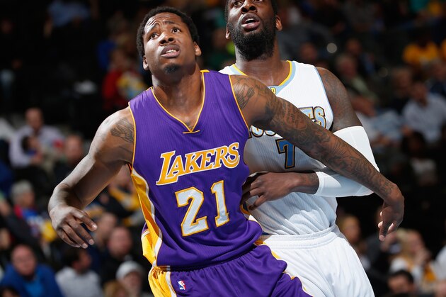 DENVER, CO - APRIL 08:  Ed Davis #21 of the Los Angeles Lakers and J.J. Hickson #7 of the Denver Nuggets battle for rebounding position at Pepsi Center on April 8, 2015 in Denver, Colorado. The Nuggets defeated the Lakers 119-101. NOTE TO USER: User expressly acknowledges and agrees that, by downloading and or using this photograph, User is consenting to the terms and conditions of the Getty Images License Agreement.  (Photo by Doug Pensinger/Getty Images)