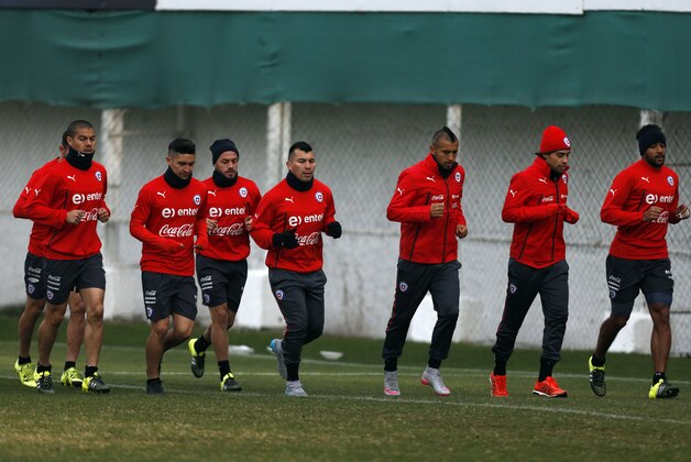 Chile players jog during a team training session in Santiago, Chile, Thursday, July 2, 2015. Chile will face Argentina in the Copa America final on Saturday. (AP Photo/Luis Hidalgo)
