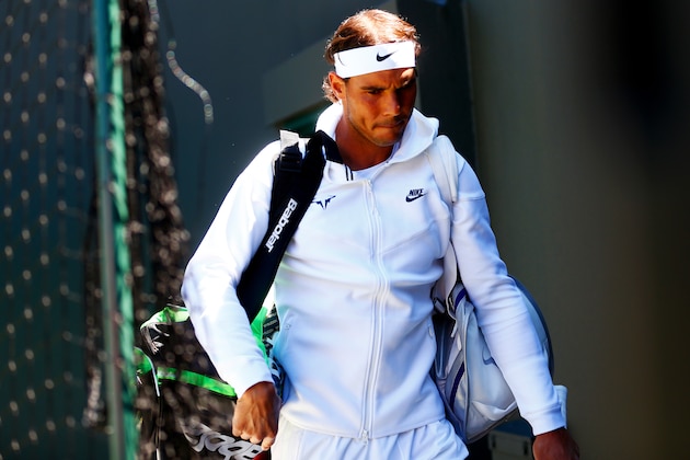 LONDON, ENGLAND - JUNE 30: Rafael Nadal of Spain walks out onto court for his Gentlemen's Singles first round match against Thomaz Bellucci of Brazil during day two of the Wimbledon Lawn Tennis Championships at the All England Lawn Tennis and Croquet Club on June 30, 2015 in London, England.  (Photo by Julian Finney/Getty Images)