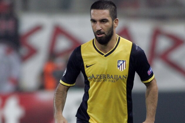 ATHENS, GREECE - SEPTEMBER 16:   Arda Turan of Club Atletico de Madrid    in action during the UEFA Champions League Group A match  between Olympiakos and Atletico Madrid at Georgios Karaiskakis Stadium on September 16,2014 in  Piraeus, Athens, Greece.   (Photo by Milos Bicanski/Getty Images)