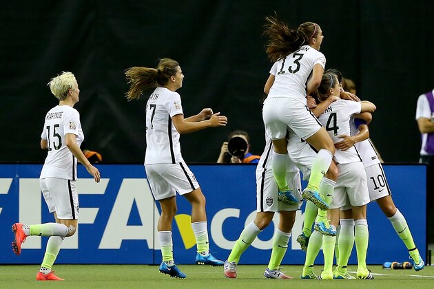 MONTREAL, QC - JUNE 30:  (R) Carli Lloyd #10 of the United States celebrates after scoring on a penalty kick for the opening goal against Germany in the FIFA Women's World Cup 2015 Semi-Final Match at Olympic Stadium on June 30, 2015 in Montreal, Canada.  (Photo by Elsa/Getty Images)