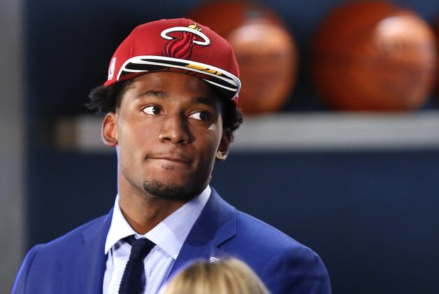 Justise Winslow waits to be interviewed after being selected 10th overall by the Miami Heat during the NBA basketball draft, Thursday, June 25, 2015, in New York. (AP Photo/Kathy Willens)