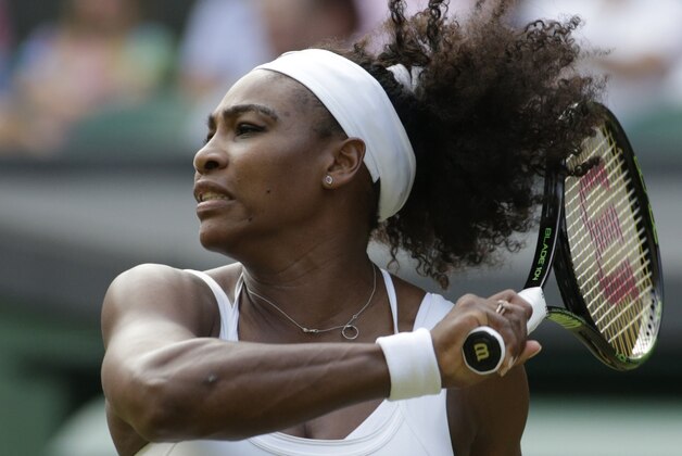 Serena Williams of the United States returns a shot to Timea Babos of Hungary  during their singles match at the All England Lawn Tennis Championships in Wimbledon, London, Wednesday July 1, 2015. (AP Photo/Alastair Grant)
