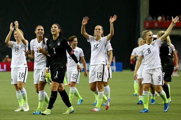 MONTREAL, QC - JUNE 30:  Alex Morgan #13, Hope Solo #1 and Lauren Holiday #12 of the United States celebrate the 2-0 victory against Germany in the FIFA Women's World Cup 2015 Semi-Final Match at Olympic Stadium on June 30, 2015 in Montreal, Canada.  (Photo by Elsa/Getty Images)