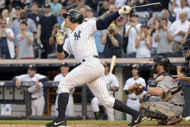 New York Yankees' Alex Rodriguez follows through on a home run during the first inning of a baseball game against the Detroit Tigers Friday, June 19, 2015, at Yankee Stadium in New York. The home run was his 3,000 hit. (AP Photo/Bill Kostroun)
