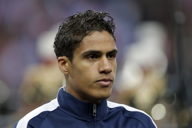 France’s Raphael Varane stands for the national anthem prior to the international friendly soccer match between France and Brazil at the Stade de France, north of Paris, France, Thursday, March 26, 2015. (AP Photo/Francois Mori)