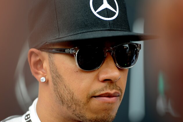 British Mercedes driver Lewis Hamilton in the paddock after the second training session for the British Formula One Grand Prix at Silverstone circuit, Silverstone, England, Friday, July 3, 2015. The British Formula One Grand Prix will be held at Sunday July 5. (AP Photo/Rui Vieira)
