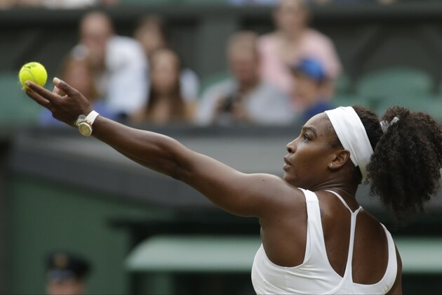 Serena Williams of the United States serves to Timea Babos of Hungary, during their singles match at the All England Lawn Tennis Championships in Wimbledon, London, Wednesday July 1, 2015. (AP Photo/Alastair Grant)