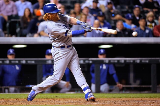 DENVER, CO - JUNE 03:  Justin Turner #10 of the Los Angeles Dodgers takes an at bat against the Colorado Rockies at Coors Field on June 3, 2015 in Denver, Colorado.  (Photo by Doug Pensinger/Getty Images)
