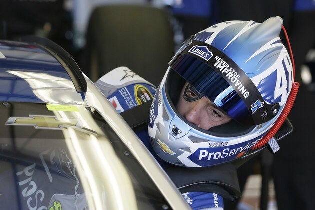 Jimmie Johnson gets into his car during practice for the NASCAR Sprint Cup Series auto race Friday, June 26, 2015, in Sonoma, Calif. (AP Photo/Eric Risberg)
