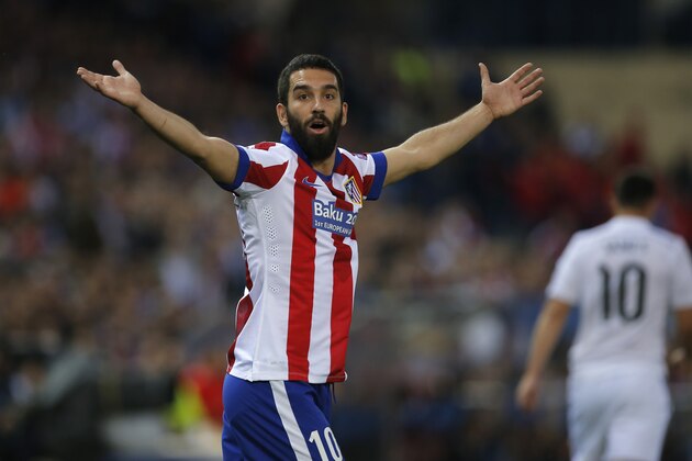 Atletico's Arda Turan reacts during the Champions League quarterfinal first leg soccer match between Atletico Madrid and Real Madrid at the Vicente Calderon stadium in Madrid, Spain, Tuesday, April 14, 2015. (AP Photo/Andres Kudacki) Atletico's Arda Turan reacts during the Champions League quarterfinal first leg soccer match between Atletico Madrid and Real Madrid at the Vicente Calderon stadium in Madrid, Spain, Tuesday, April 14, 2015. (AP Photo/Andres Kudacki)