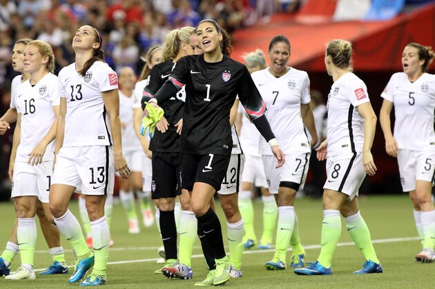 MONTREAL, QC - JUNE 30:  Alex Morgan #13 and Hope Solo #1 of the United States celebrate the 2-0 victory against Germany in the FIFA Women's World Cup 2015 Semi-Final Match at Olympic Stadium on June 30, 2015 in Montreal, Canada.  (Photo by Francois Laplante/FreestylePhoto/Getty Images)