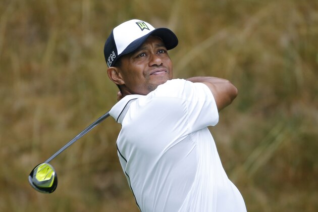 Tiger Woods watches his tee shot on the sixth tee during the second round of the Greenbrier Classic golf tournament at the Greenbrier Resort  in White Sulphur Springs, W.Va., Friday, July 3, 2015. Rain caused delays in play.  (AP Photo/Steve Helber)