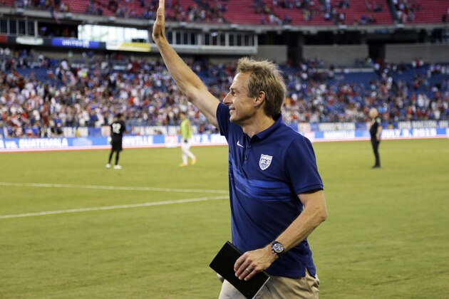 U.S. coach Jurgen Klinsmann waves to the crowd as he leaves the pitch following the team's international friendly soccer match against Guatemala on Friday, July 3, 2015, in Nashville, Tenn. The United States won 4-0. (AP Photo/Mark Humphrey)