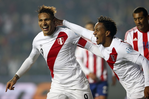 Peru's Jose Paolo Guerrero, left, celebrates with teammate Andre Carrillo after scoring his team's second goal during the soccer match for the third place of the Copa America at the Ester Roa Rebolledo Stadium in Concepcion, Chile, Friday, July 3, 2015. Peru won the match 2-0.(AP Photo/Andre Penner)