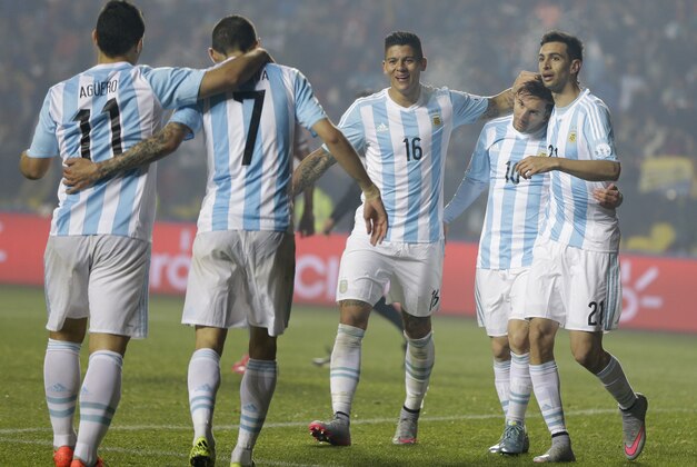 Argentina's players, from left, Javier Pastore, Lionel Messi, Marcos Rojo, Angel Di Maria and Sergio Aguero celebrate the goal by Di Maria, 7, during a Copa America semifinal soccer match at the Ester Roa Rebolledo Stadium in Concepcion, Chile, Tuesday, June 30, 2015. (AP Photo/Ricardo Mazalan)