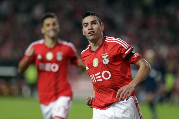 Benfica's Nicolas Gaitan, from Argentina, celebrates after scoring the opening goal against Gil Vicente during a Portuguese league soccer match between Benfica and Gil Vicente at Benfica's Luz stadium, in Lisbon, Sunday, Dec. 21, 2014. (AP Photo/Francisco Seco) Benfica's Nicolas Gaitan, from Argentina, celebrates after scoring the opening goal against Gil Vicente during a Portuguese league soccer match between Benfica and Gil Vicente at Benfica's Luz stadium, in Lisbon, Sunday, Dec. 21, 2014. (AP Photo/Francisco Seco)