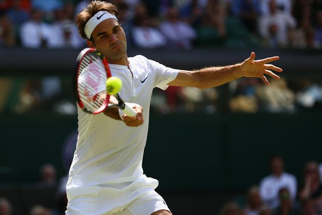 LONDON, ENGLAND - JULY 04:  Roger Federer of Switzerland plays a forehand in his Mens Singles Third Round match against Sam Groth of Australia during day six of the Wimbledon Lawn Tennis Championships at the All England Lawn Tennis and Croquet Club on July 4, 2015 in London, England.  (Photo by Clive Brunskill/Getty Images)