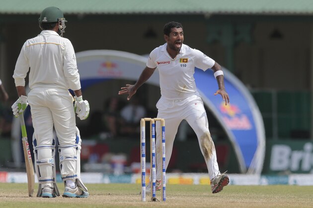 Sri Lankan bowler Dhammika Prasad celebrates taking the wicket of Pakistan's batsman Sarfraz Ahmed during the fourth day's play of their second test cricket match, in Colombo, Sri Lanka, Sunday, June 28, 2015. (AP Photo/Eranga Jayawardena)