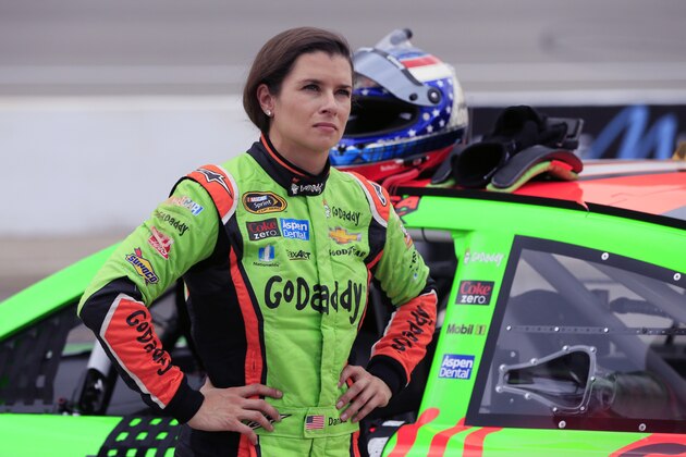 Danica Patrick stands by her car after qualifying for Sunday's NASCAR Sprint Cup series auto race at Michigan International Speedway, Friday, June 12, 2015, in Brooklyn, Mich. (AP Photo/Carlos Osorio)