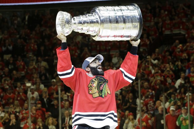 Chicago Blackhawks’ Johnny Oduya, of Sweden, celebrates after defeating the Tampa Bay Lightning in Game 6 of the NHL hockey Stanley Cup Final series on Monday, June 15, 2015, in Chicago. The Blackhawks defeated the Lightning 2-0 to win the series 4-2. (AP Photo/Nam Y. Huh)