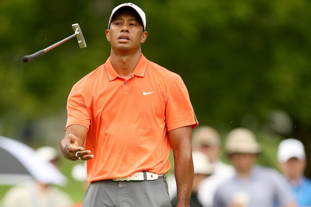 WHITE SULPHUR SPRINGS, WV - JULY 04:  Tiger Woods reacts to a missed birdie putt on the fourth hole during the third round of the Greenbrier Classic at the Old White TPC on July 4, 2015 in White Sulphur Springs, West Virginia.  (Photo by Darren Carroll/Getty Images)