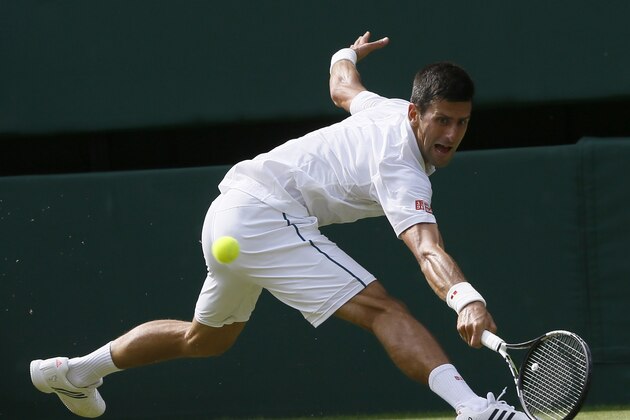 Novak Djokovic of Serbia returns a ball to Bernard Tomic of Australia during their singles match at the All England Lawn Tennis Championships in Wimbledon, London, Friday July 3, 2015. (AP Photo/Kirsty Wigglesworth) Novak Djokovic of Serbia returns a ball to Bernard Tomic of Australia during their singles match at the All England Lawn Tennis Championships in Wimbledon, London, Friday July 3, 2015. (AP Photo/Kirsty Wigglesworth)