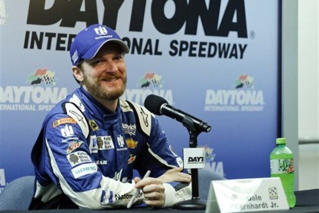 Dale Earnhardt Jr. answers questions during a news conference after qualifying for the Sprint Cup Series was canceled at Daytona International Speedway, Saturday, July 4, 2015, in Daytona Beach, Fla. Earnhardt will start on the pole for the race. (AP Photo/Terry Renna)