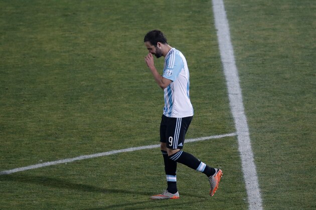Argentina's Gonzalo Higuain reacts after missing a penalty kick against Chile during the Copa America final soccer match at the National Stadium in Santiago, Chile, Saturday, July 4, 2015. (AP Photo/Silvia Izquierdo)