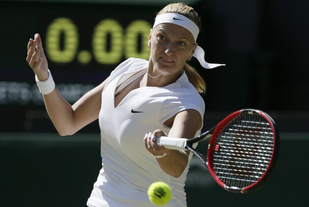 Petra Kvitova of the Czech Republic plays a return to Jelena Jankovic of Serbia during their singles match at the All England Lawn Tennis Championships in Wimbledon, London, Saturday July 4, 2015. (AP Photo/Tim Ireland)