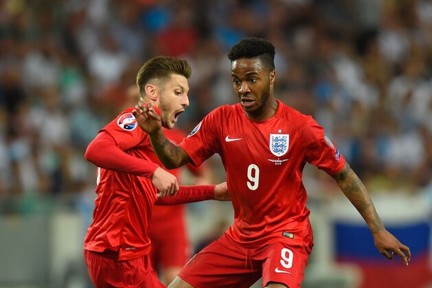 LJUBLJANA, SLOVENIA - JUNE 14:  England player Raheem Sterling (r) and Adam Lallana in action during the UEFA EURO 2016 Qualifier between Slovenia and England on at the Stozice Arena on June 14, 2015 in Ljubljana, Slovenia.  (Photo by Stu Forster/Getty Images)