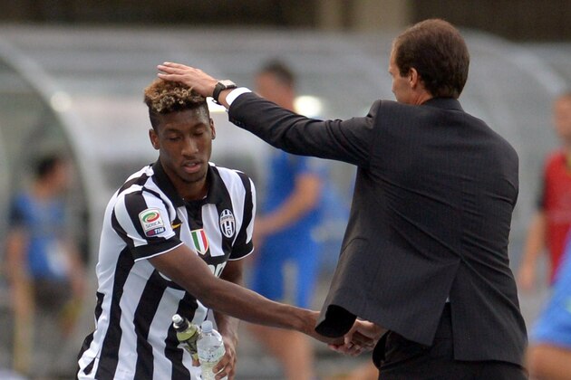 VERONA, ITALY - AUGUST 30:  Head coach  of Juventus Massimiliano Allegri (R) shakes hands with Kingsley Coman during the Serie A match between AC Chievo Verona and Juventus FC at Stadio Marc'Antonio Bentegodi on August 30, 2014 in Verona, Italy.  (Photo by Dino Panato/Getty Images)