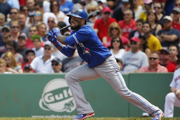 Toronto Blue Jays' Jose Reyes swings against the Boston Red Sox during the third inning of a baseball game at Fenway Park in Boston Saturday, June 13, 2015. (AP Photo/Winslow Townson)