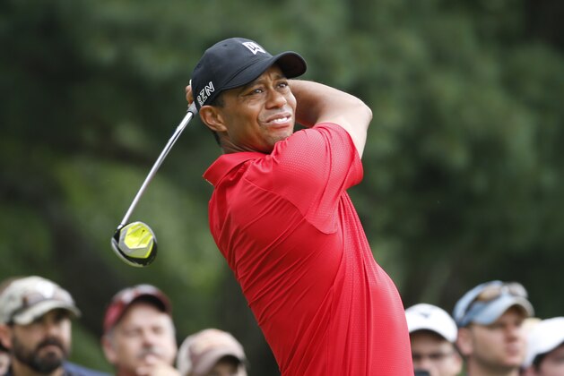 Tiger Woods watches his tee shot on the eighth hole during the final round of the Greenbrier Classic golf tournament at the Greenbrier Resort  in White Sulphur Springs, W.Va., Sunday, July 5, 2015.  (AP Photo/Steve Helber)