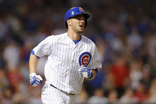 Chicago Cubs' Kris Bryant watches his two-run home run off Los Angeles Dodgers starting pitcher Clayton Kershaw during the third inning of a baseball game Monday, June 22, 2015, in Chicago. (AP Photo/Charles Rex Arbogast)