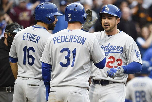 SAN DIEGO, CA - APRIL  25:  Adrian Gonzalez #23 of the Los Angeles Dodgers, right, is congratulated by Andre Ethier #16 and Joc Pederson #31 after he hit a three-run home run during the second inning of a baseball game against the San Diego Padres at Petco Park April 25,  2015 in San Diego, California.   (Photo by Denis Poroy/Getty Images)