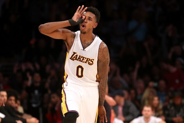 LOS ANGELES, CA - NOVEMBER 30:  Nick Young #0 of the Los Angeles Lakers celebrates after making a three point shot late in the fourth quarter against the Toronto Raptors at Staples Center on November 30, 2014 in Los Angeles, California. The Lakers 129-122 in overtime. NOTE TO USER: User expressly acknowledges and agrees that, by downloading and or using this photograph, User is consenting to the terms and conditions of the Getty Images License Agreement.  (Photo by Stephen Dunn/Getty Images)